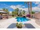 The backyard features a desert landscaped pool with a rock waterfall and a covered gazebo at 4152 S Bandit Ct, Gilbert, AZ 85297