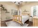 Bright and cozy bedroom with wood flooring, comfortable bed, and plenty of natural light at 4152 S Bandit Ct, Gilbert, AZ 85297