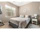 Bedroom with a neutral palette, a large window, and an area rug, offering a calming retreat at 4152 S Bandit Ct, Gilbert, AZ 85297