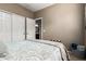 Bedroom with an ensuite bathroom featuring a double door closet and warm carpet at 4152 S Bandit Ct, Gilbert, AZ 85297