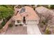 Charming single-Gathering home featuring desert landscaping, a tile roof, and solar panels for energy efficiency at 4152 S Bandit Ct, Gilbert, AZ 85297