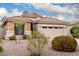 Inviting single-story home featuring desert landscaping and a two-car garage at 4152 S Bandit Ct, Gilbert, AZ 85297