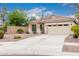 Inviting single-story home featuring desert landscaping and a two-car garage at 4152 S Bandit Ct, Gilbert, AZ 85297