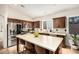 Stylish kitchen with stainless steel appliances, dark wood cabinets, and a bright countertop at 4152 S Bandit Ct, Gilbert, AZ 85297