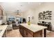 Bright kitchen island with seating and open concept to the living room, offering a great view of the backyard at 4152 S Bandit Ct, Gilbert, AZ 85297