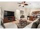 Open-concept living space with comfortable seating, a media center, and easy access to the kitchen at 4152 S Bandit Ct, Gilbert, AZ 85297
