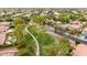 Aerial shot of the neighborhood featuring tree-lined streets and well-maintained sidewalks at 4152 S Bandit Ct, Gilbert, AZ 85297