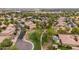 Aerial view highlighting the serene neighborhood with lush trees and manicured green spaces at 4152 S Bandit Ct, Gilbert, AZ 85297