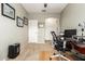Home office area featuring a ceiling fan, carpet floors, and natural lighting at 4152 S Bandit Ct, Gilbert, AZ 85297