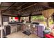 Outdoor kitchen in gazebo with a grill, refrigerator, and storage, ready for outdoor cooking at 4152 S Bandit Ct, Gilbert, AZ 85297