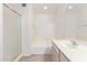 Well-lit bathroom with shower over bath and updated vanity at 4201 W Renee Dr, Glendale, AZ 85308