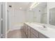 Bright bathroom featuring double sinks and bathtub with shower at 4201 W Renee Dr, Glendale, AZ 85308