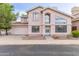 Two-story home featuring a two car garage, well-manicured lawn, and covered entrance at 4201 W Renee Dr, Glendale, AZ 85308