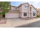 Two-story home with attached garage, well maintained lawn and desert landscaping at 4201 W Renee Dr, Glendale, AZ 85308