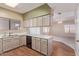 Traditional style kitchen featuring wood-look floors and updated appliances at 4201 W Renee Dr, Glendale, AZ 85308