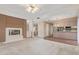 Open living room with fireplace, wet bar, and easy access to the dining area at 4201 W Renee Dr, Glendale, AZ 85308