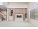 Open-concept living room featuring fireplace and access to the kitchen at 4201 W Renee Dr, Glendale, AZ 85308