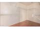 Spacious walk-in closet with laminate floors and multiple adjustable white wire storage shelves at 42796 W Wild Horse Trl, Maricopa, AZ 85138