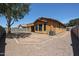 View of the backyard with gravel and fence in good sunlight at 45633 W Mountain View Rd, Maricopa, AZ 85139