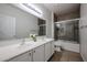 Bathroom showcasing double sinks, spacious countertops, and shower at 45633 W Mountain View Rd, Maricopa, AZ 85139