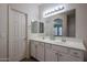 Bright bathroom featuring a double sink vanity, white cabinetry, and neutral paint at 45633 W Mountain View Rd, Maricopa, AZ 85139