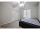 Cozy bedroom with a ceiling fan, window, and closet at 45633 W Mountain View Rd, Maricopa, AZ 85139
