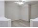 Versatile bonus room with wood-look floors, neutral paint, ceiling fan, and ample natural light at 45633 W Mountain View Rd, Maricopa, AZ 85139