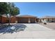 Charming single-story home featuring a three-car garage, tile roof, and low-maintenance desert landscaping at 45633 W Mountain View Rd, Maricopa, AZ 85139
