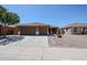 Charming single-story home featuring a three-car garage, tile roof, and low-maintenance desert landscaping at 45633 W Mountain View Rd, Maricopa, AZ 85139