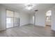 Bright main bedroom with great light, a ceiling fan, and sliding door access to the patio at 45633 W Mountain View Rd, Maricopa, AZ 85139