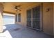 Covered patio with ceiling fan, security door, and concrete flooring at 45633 W Mountain View Rd, Maricopa, AZ 85139
