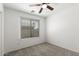 Cozy bedroom featuring natural light from window with neutral carpet at 46123 W Sheridan Rd, Maricopa, AZ 85139