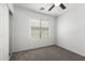 Bedroom with carpet and large window at 46123 W Sheridan Rd, Maricopa, AZ 85139