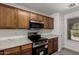 Modern kitchen equipped with stainless steel appliances, marble countertops, and ample cabinet space at 46123 W Sheridan Rd, Maricopa, AZ 85139