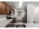 Well-appointed kitchen featuring modern stainless steel appliances and marble countertops at 46123 W Sheridan Rd, Maricopa, AZ 85139