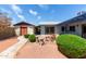 Inviting backyard with unique desert landscaping, accent plants, and a detached garage at 5215 W Onyx Ave, Glendale, AZ 85302