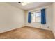 Bedroom featuring blue curtains and tile flooring at 5215 W Onyx Ave, Glendale, AZ 85302