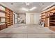 Spacious garage with concrete floor and shelving units, offering ample storage space at 5215 W Onyx Ave, Glendale, AZ 85302