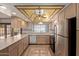 Well-appointed kitchen with stainless steel appliances and ample counter space at 5215 W Onyx Ave, Glendale, AZ 85302
