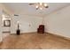 Spacious living room with tile flooring and a cozy armchair at 5215 W Onyx Ave, Glendale, AZ 85302