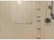 Shower stall features a showerhead, grab bar, and built-in shelves at 5215 W Onyx Ave, Glendale, AZ 85302