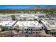 Scenic aerial view of an open-air shopping mall featuring a variety of retail outlets and dining options, surrounded by lush greenery at 5221 N 24Th St # 103, Phoenix, AZ 85016