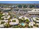 Bright aerial view showcasing community pool, covered parking, and city skyline in a desirable urban location at 5221 N 24Th St # 103, Phoenix, AZ 85016