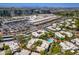 Scenic aerial view of residential community with a pool near shopping, set against a beautiful mountain backdrop at 5221 N 24Th St # 103, Phoenix, AZ 85016