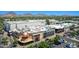 Aerial view showcasing a Cheesecake Factory restaurant and other stores in a shopping complex with mountain views at 5221 N 24Th St # 103, Phoenix, AZ 85016