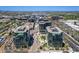 Striking aerial view of modern office buildings amidst lush landscaping and accessible parking in an urban setting at 5221 N 24Th St # 103, Phoenix, AZ 85016