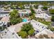 Aerial view of residential neighborhood showing lush landscaping, community pool, and beautiful tile roofs at 5221 N 24Th St # 103, Phoenix, AZ 85016