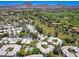 Expansive aerial shot of a golf course community with mountain views, highlighting nearby residential options at 5221 N 24Th St # 103, Phoenix, AZ 85016