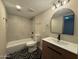 Bathroom featuring a bathtub, shower, and vanity with modern fixtures at 5221 N 24Th St # 103, Phoenix, AZ 85016