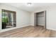 Well-lit bedroom featuring light walls, wood flooring, and a closet for ample storage space at 5221 N 24Th St # 103, Phoenix, AZ 85016